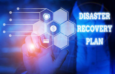 Handwriting text writing Disaster Recovery Plan. Conceptual photo having backup measures against dangerous situation Woman wear formal work suit presenting presentation using smart device