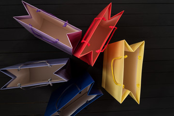 Five empty multi-colored shopping bags. Top view. No shopping