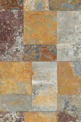 Destroyed by rust wall tiles with delamination and pores. Smooth regular seams. Super abstract beautiful original background