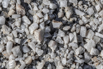 Beautiful texture of transparent white quartz crystal rough stones. Natural stones and minerals