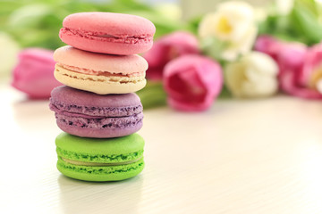 Tasty macarons on table, close up