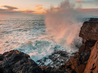 Storm at Atlantic ocean, West coast of Ireland, county Clare, Wave hits rocks and created huge...