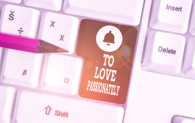 Conceptual hand writing showing To Love Passionately. Concept meaning Strong feeling for someone or something else Affection White pc keyboard with note paper above the white background