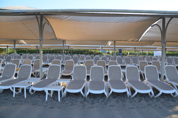 sunbeds on the beach are ready to receive vacationers