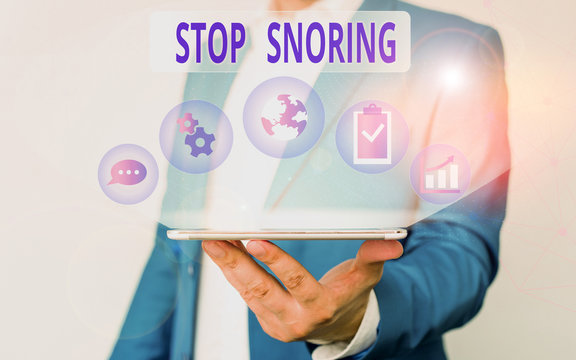 Handwriting text writing Stop Snoring. Conceptual photo noisy breathing during sleep due to vibrating airway tissue Male human wear formal work suit presenting presentation using smart device