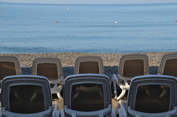 sunbeds on the beach are ready to receive vacationers