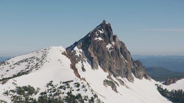 Cascade Mountains, Oregon circa-2019.  Aerial view of Mount Thielsen.  Shot from helicopter with Cineflex gimbal and RED 8K camera.