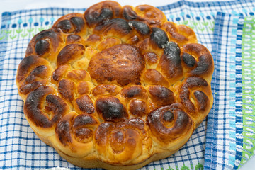 burnt cake on a blue tablecloth at the fair