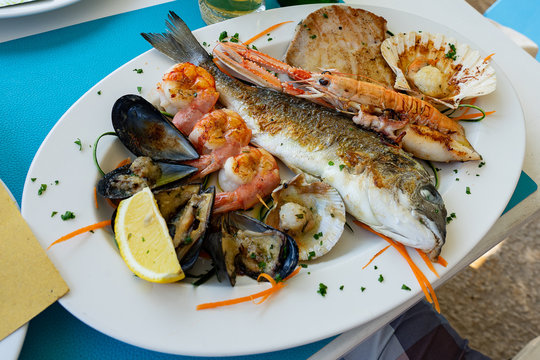 seafood fish platter in Valun Cres island Croatia with tuna fish shrimps and mussels