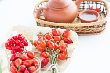 herbal tea with rose hips isolated on white, Medicinal plants and herbs composition	