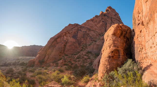 Beight Sun Peaking Behind Mountains During Sunset in Snow Canyon National Park