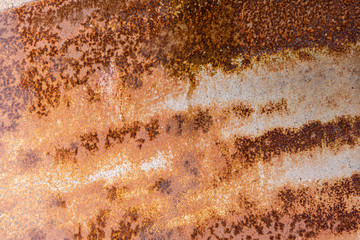 The old, dirty and corroded metal plate with rusty surface, close up.