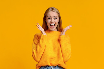 Surprised teenage girl opened mouth in amazement