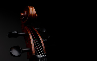 A close up high resolution image of a cello scroll, peg box, and tuning pegs isolated against a...