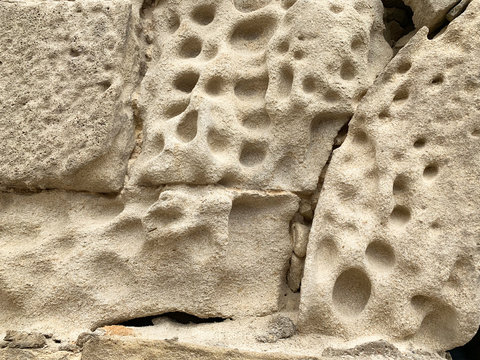 The porous structure of the stone from which the Palace of Shirvanshahs was built in the historic district of Icheri Sheher (Old town), 15th century. Azerbaijan, Baku city
