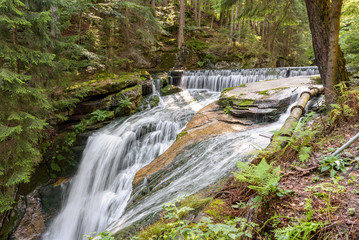 Fototapeta na wymiar Waterfall of Szklarka river in Giant Mountains