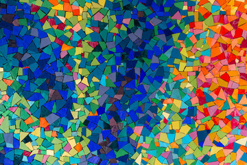 Multicolored abstract wall, texture from ceramic triangle colorful pieces