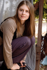 Obraz premium picture long-haired girl rider posing for portrait