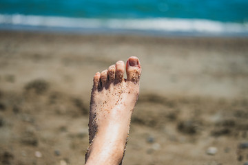 Sandy feet at beach