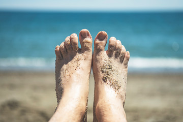 Sandy feet at beach