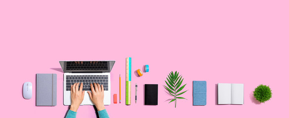 Person using a laptop computer from above