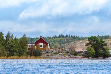 Finland. Picturesque house on a rocky island. Baltic sea. Islands in the Gulf of Finland. Northern nature. House for outdoor recreation.