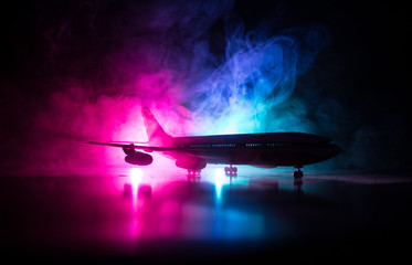 Artwork decoration. White passenger plane ready to taking off from airport runway. Silhouette of...
