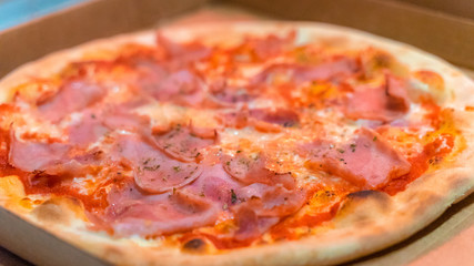 Pizza in its packaging, ready to be transported to the customer, worked pizza,