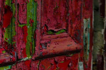 Flaking red painted door
