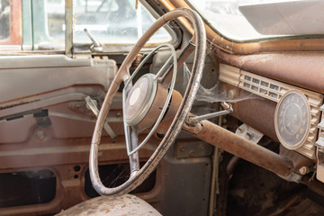 Steering wheel of an old abandoned rusty car