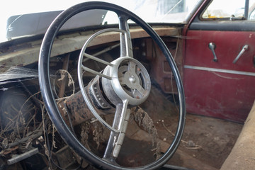 Steering wheel of an old abandoned rusty car