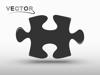 Puzzle icon silhouette, with shadow. Vector element on isolated light background.
