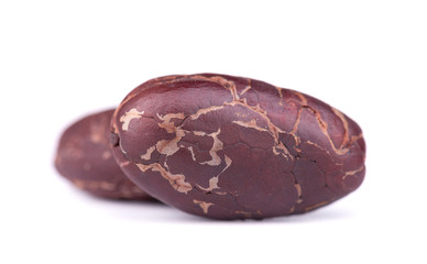 Peeled cacao beans, isolated on white background. Roasted and aromatic cocoa beans, natural chocolate.