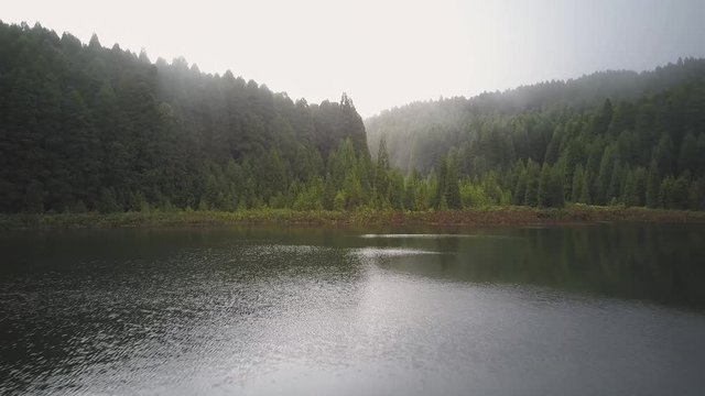 Flying Over Foggy Mountain Lake