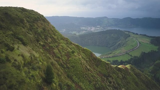 Reveal Volcano Lake Behind Grass Hill