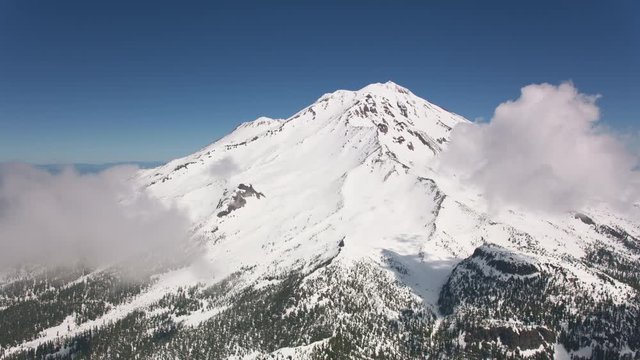 Cascade Mountains, circa-2019.  Aerial view of Mount Shasta.  Shot from helicopter with Cineflex gimbal and RED 8K camera.