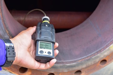 Human using the gas detector for detect combustible gas , flammable gas , toxic gas and oxygen...