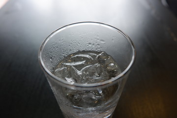 Glass with water and ice cubes