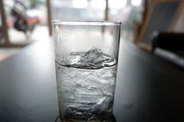 Glass with water and ice cubes