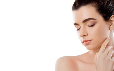 Fototapeta premium Beautiful Young Woman with Clean Fresh Skin touch own face. Cosmetology, beauty and spa.