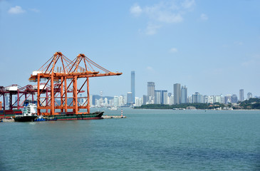 View on the container terminal and gantry cranes loading containers on the cargo ship in the port...