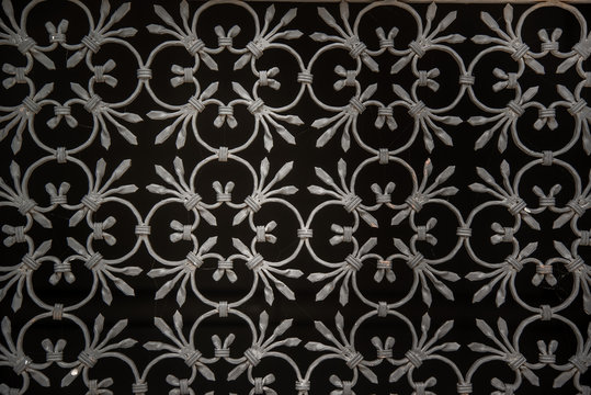 ornate wrought-iron elements of metal gate decoration.