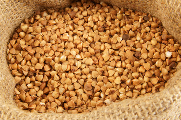 Buckwheat in jute sack close up