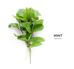 Creative layout made of mint. Flat lay. Food concept. Vegetables isolated on white background.