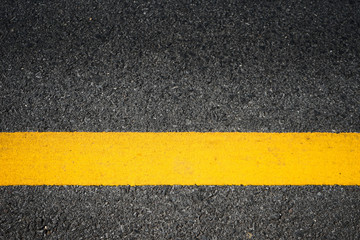 Road traffic paint Yellow on the asphalt surface