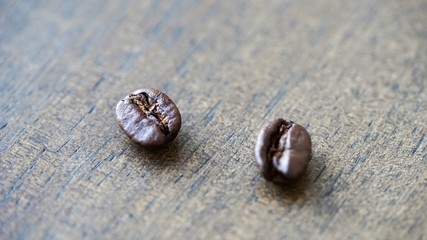 coffee beans on light brown wooden background