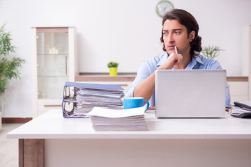 Young male employee working at home