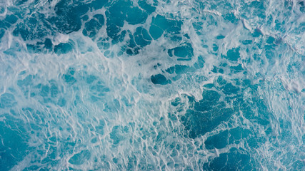Texture of marine splashes. crashing ocean wave foam structure. Dark blue clear water. Ocean depth.