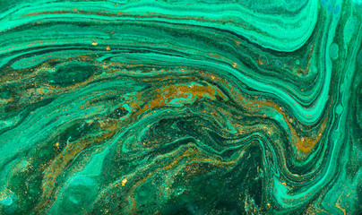 Green and gold ripple of agate background. Golden powder marble texture.