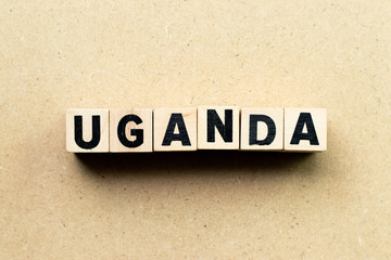 Letter block in word Uganda on wood background